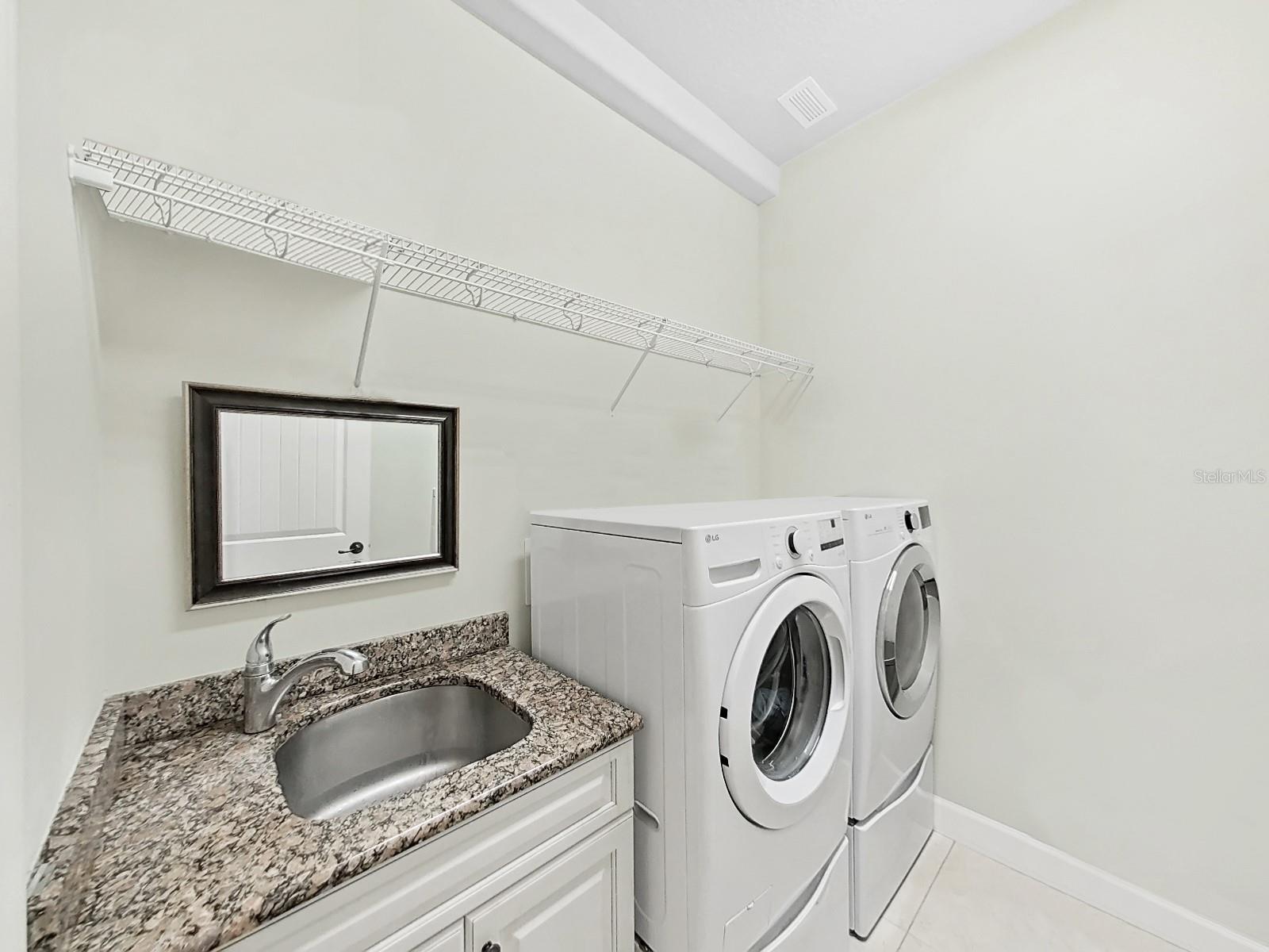 Laundry Room with Sink with Granite Counter Top.