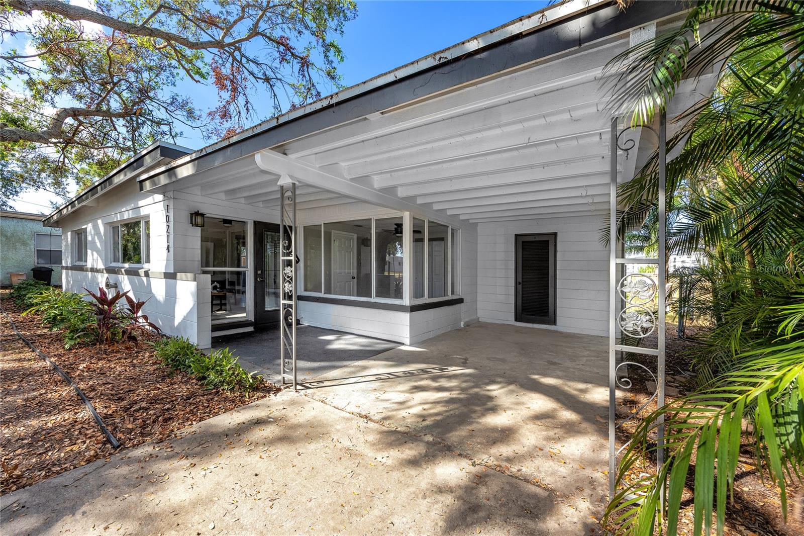 Covered transition from carport to front door to keep you dry in the rain!