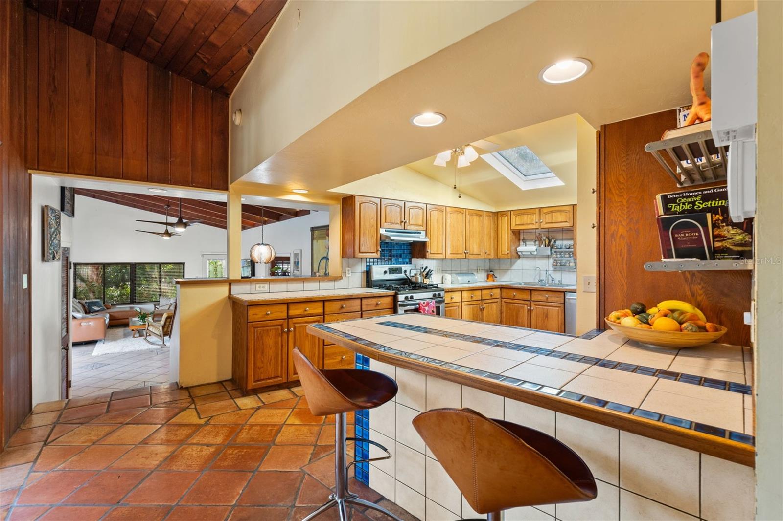 Kitchen bar, kitchen opens to the Birdcage Dining Deck