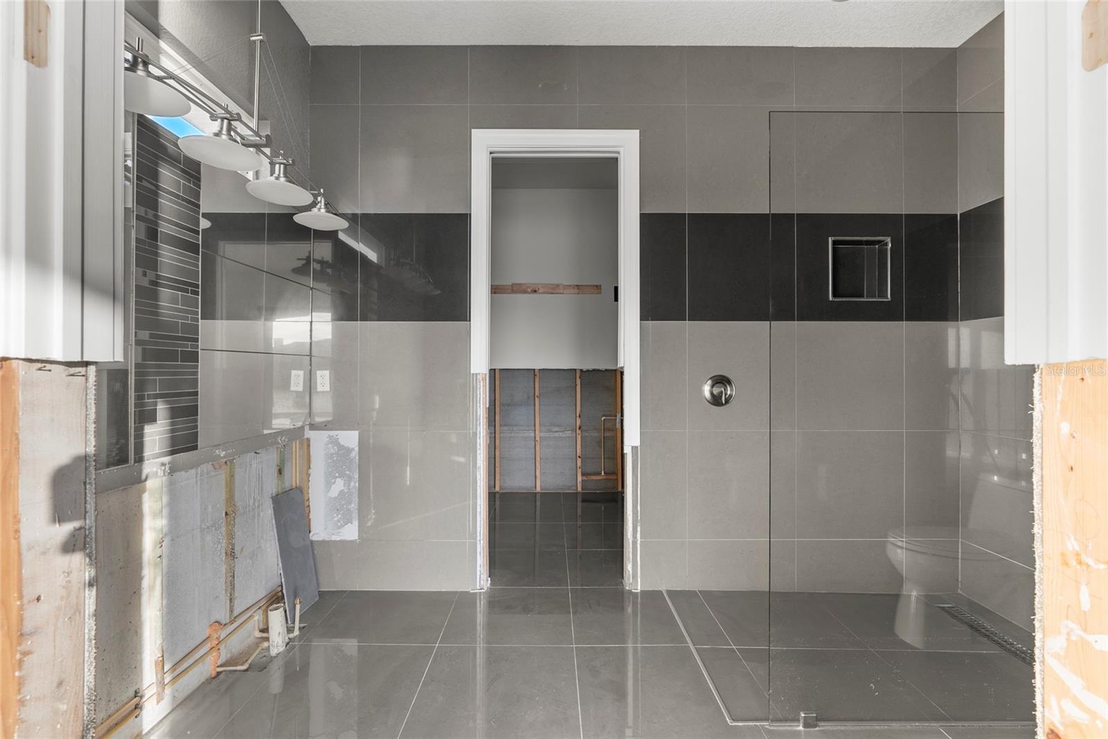 Post-Storm view of primary bathroom.  The sinks and countertop were preserved in the remediation