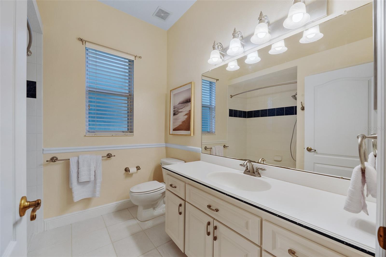 Secondary bathroom has a tub/shower combination.