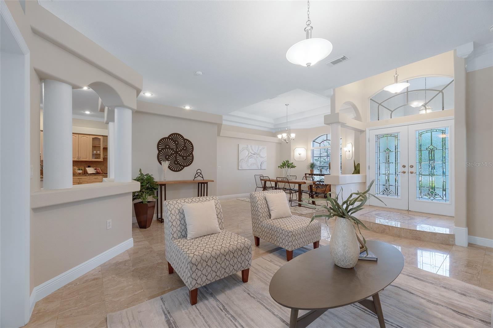 Travertine stone flooring throughout the living room & dining room