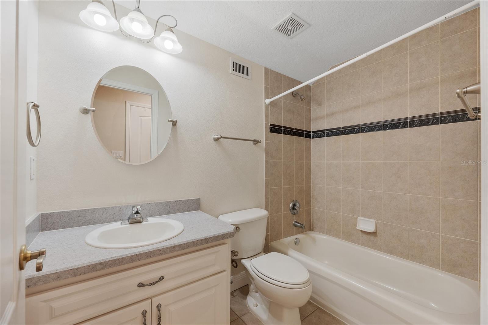 Upstairs full bathroom with tub/shower combination.