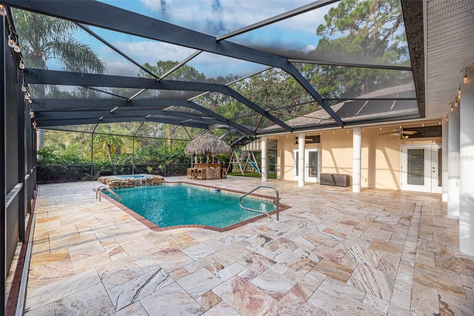 There is plenty of room for sun lounging furniture around the entire pool.