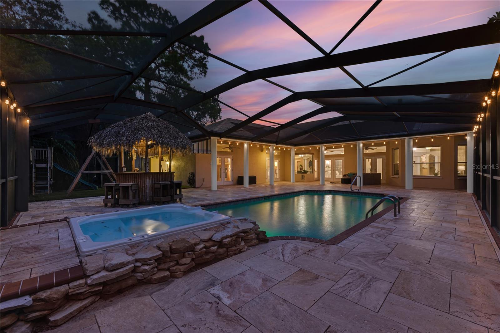 The pool area is stunning at dusk and into the evening with a color changing pool light and surrounding party lights.