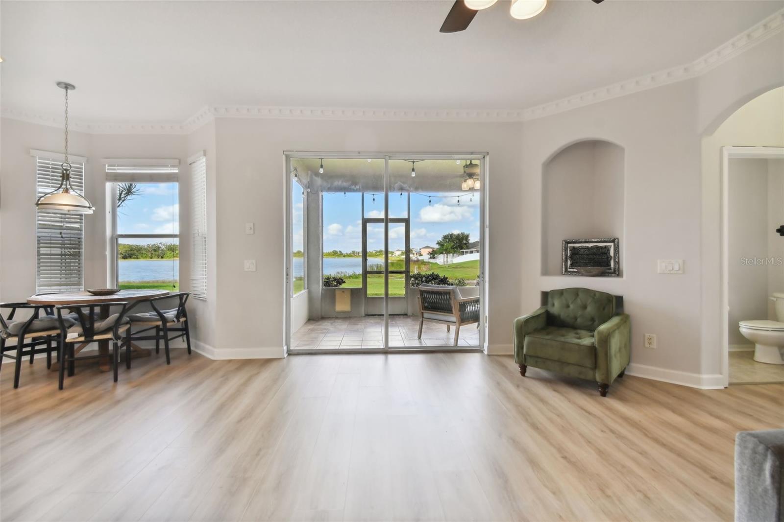 Family room to dinette , back patio screened lanai water view