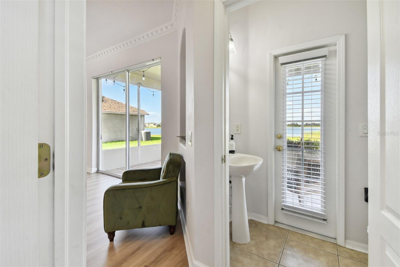 1/2 bath powder room off back patio and family room