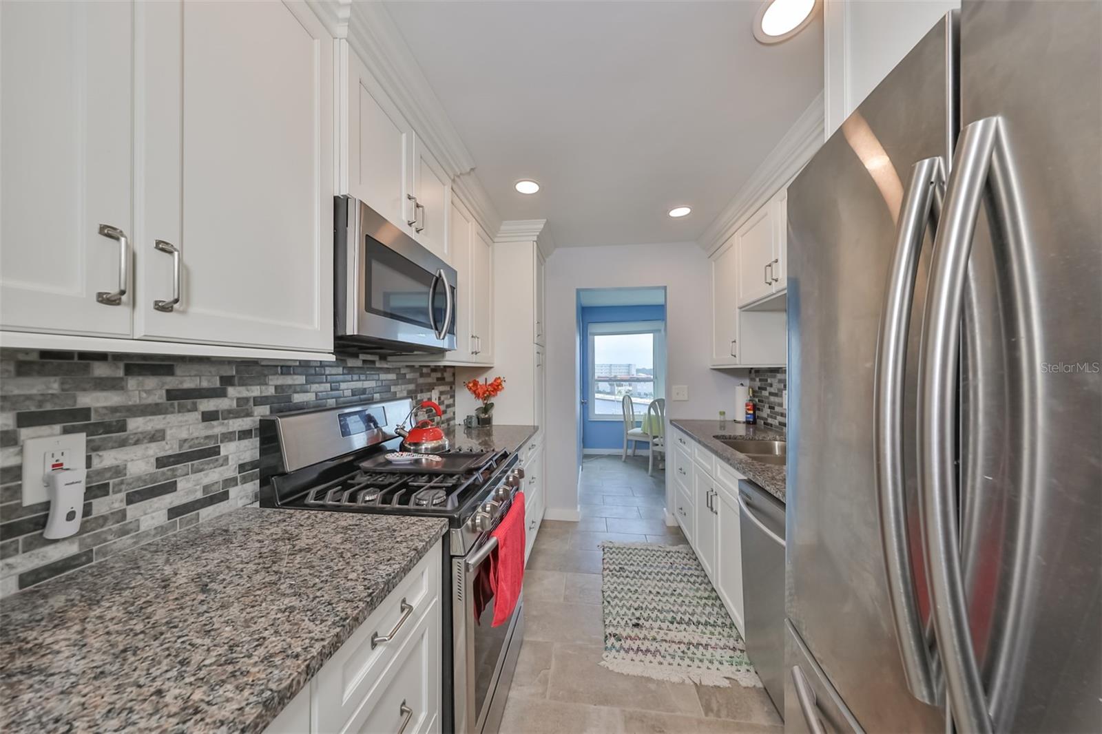 Kitchen updates include granite counters, stainless appliances