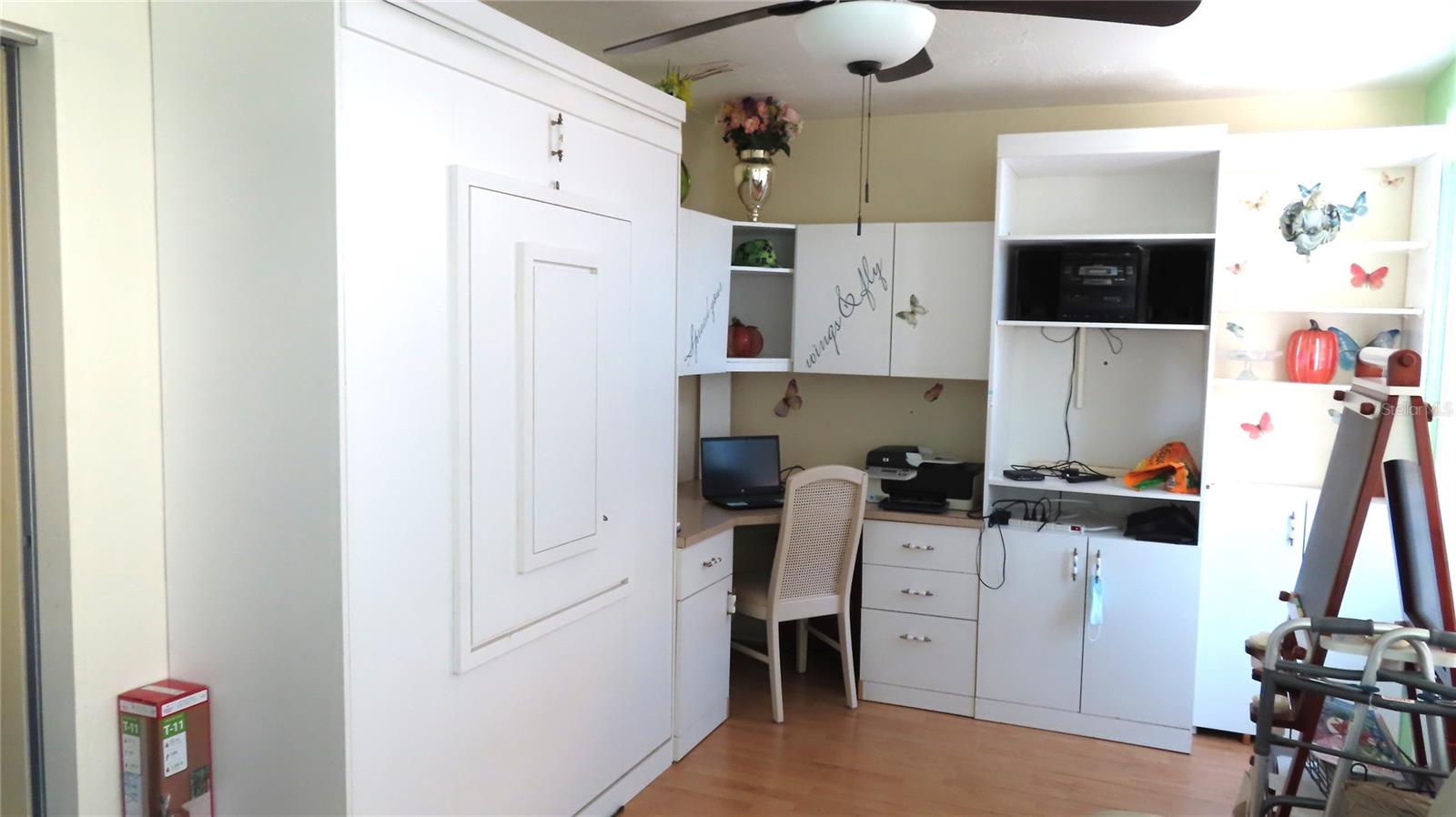 Custom built shelves with a Murphy bed