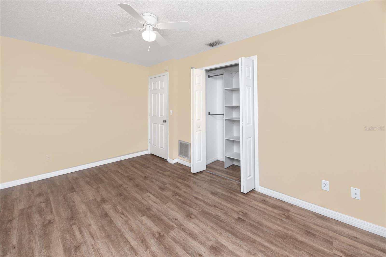 Guest bedroom with built in closet organizers