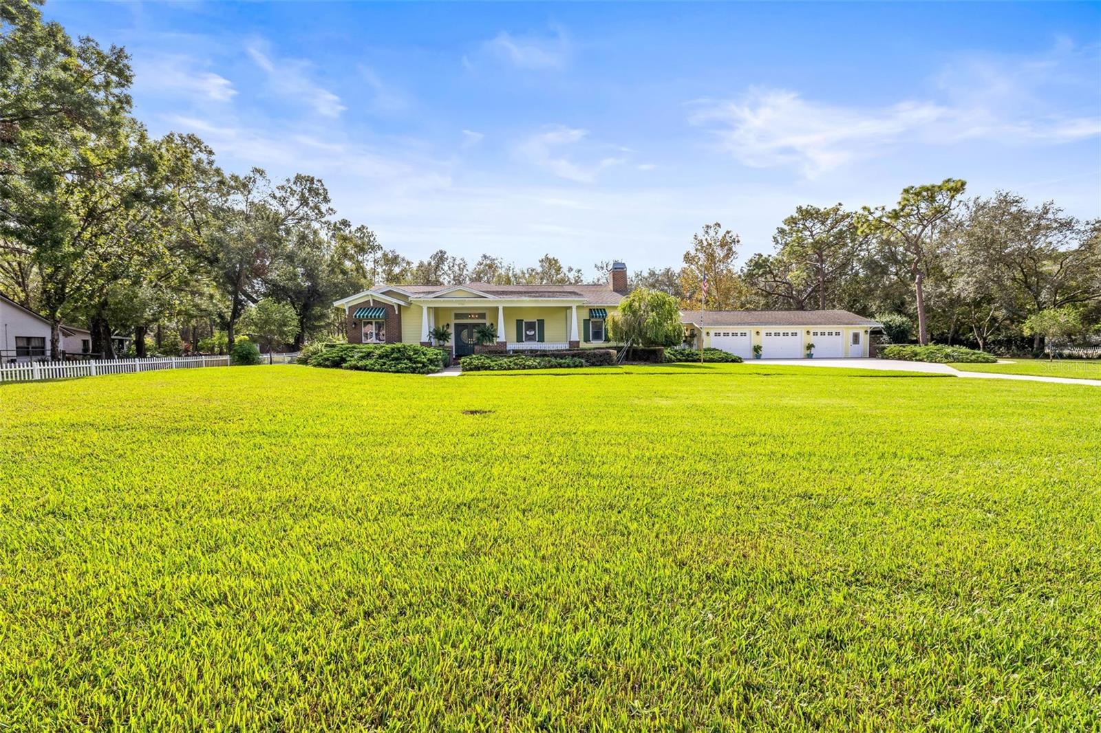 Front view of home and large front yard