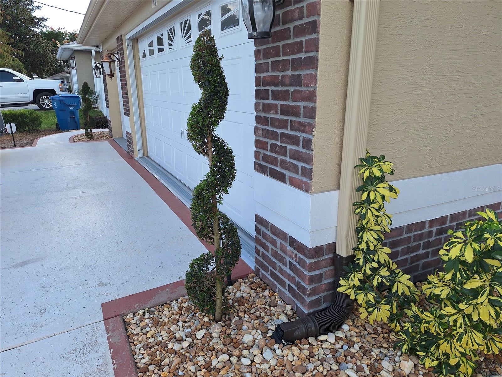 Spiral Plant on Each Side of Garages.