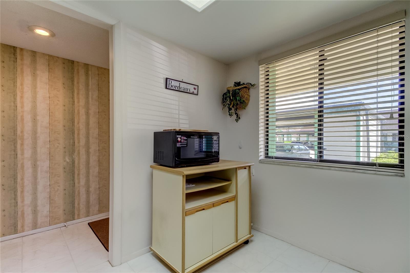 Kitchen is roomy enough for a 2-person dinette.. sip your morning coffee, while looking out the window..