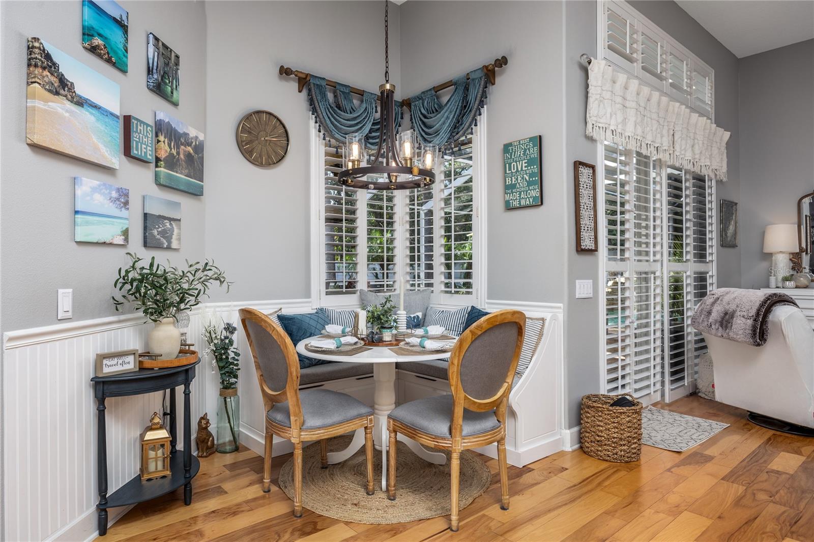 Breakfast Nook with seamless corner window overlooking the pool area