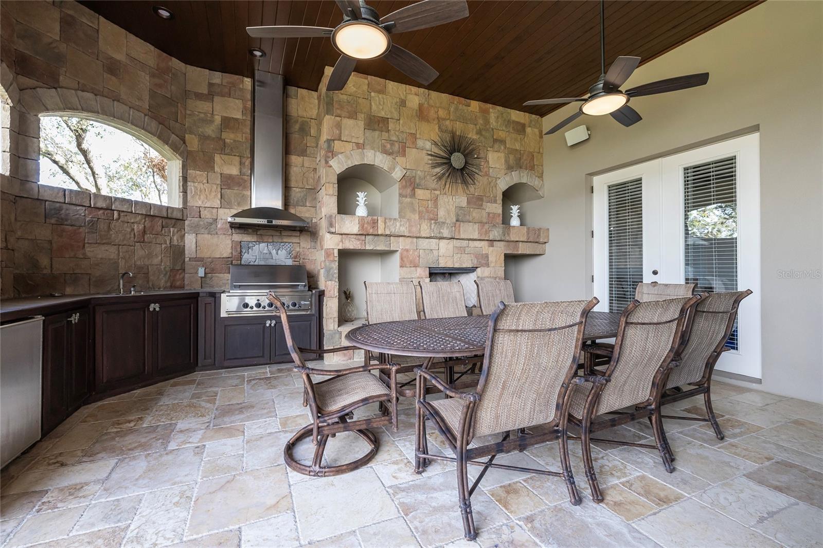 Outdoor kitchen also has a fireplace