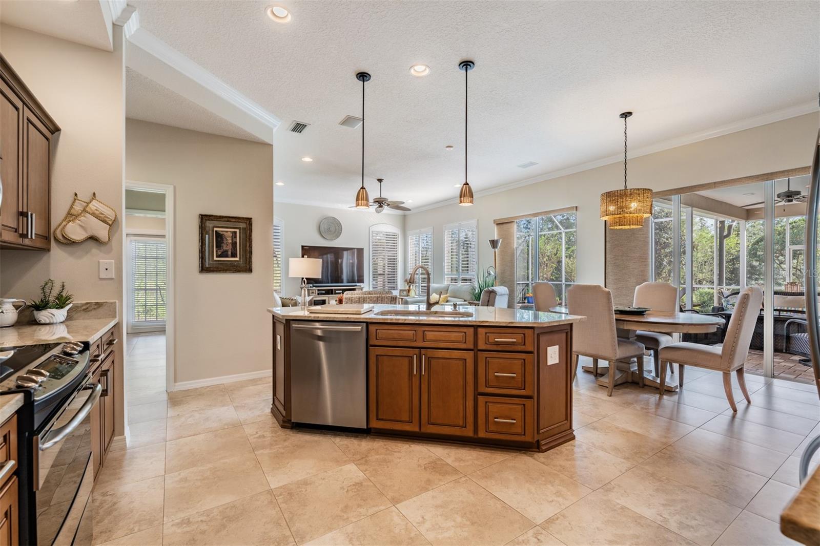 Updated Kitchen - New Cabinets, New Quartzite, Stainless Steel Appliances, Crown Molding and Drop Down Lights.