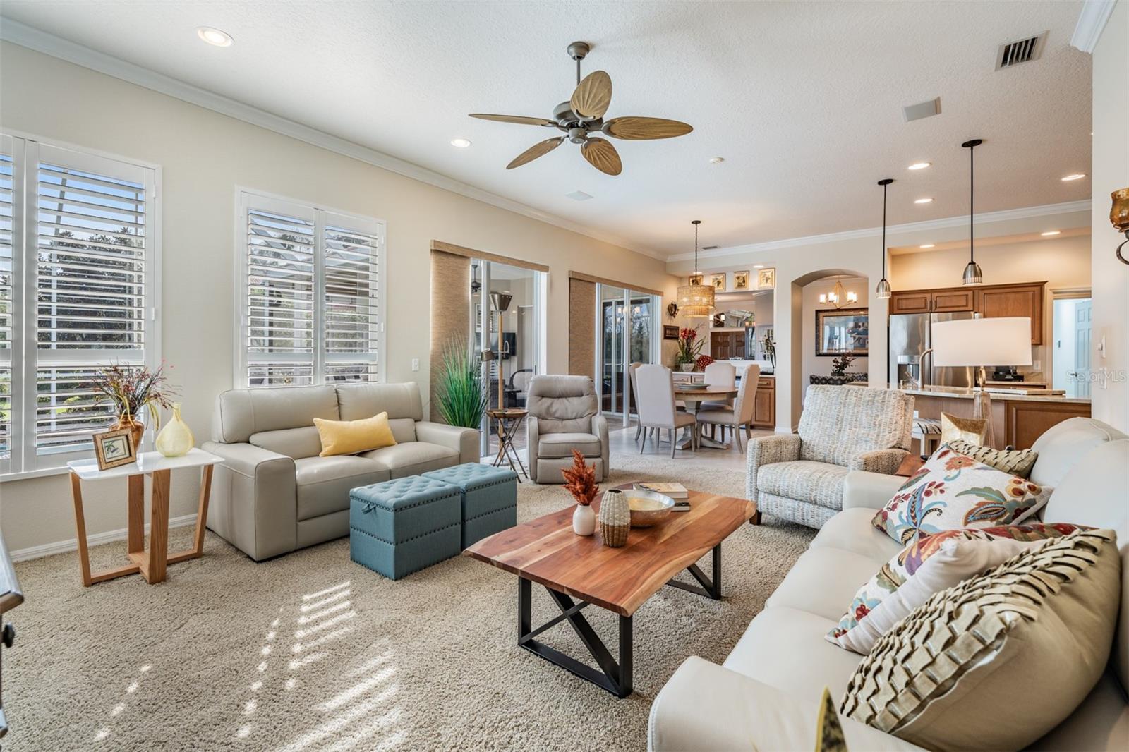 Sunny and nice sized Great Room, Inset lighting, ceiling fan and plantation shutters.