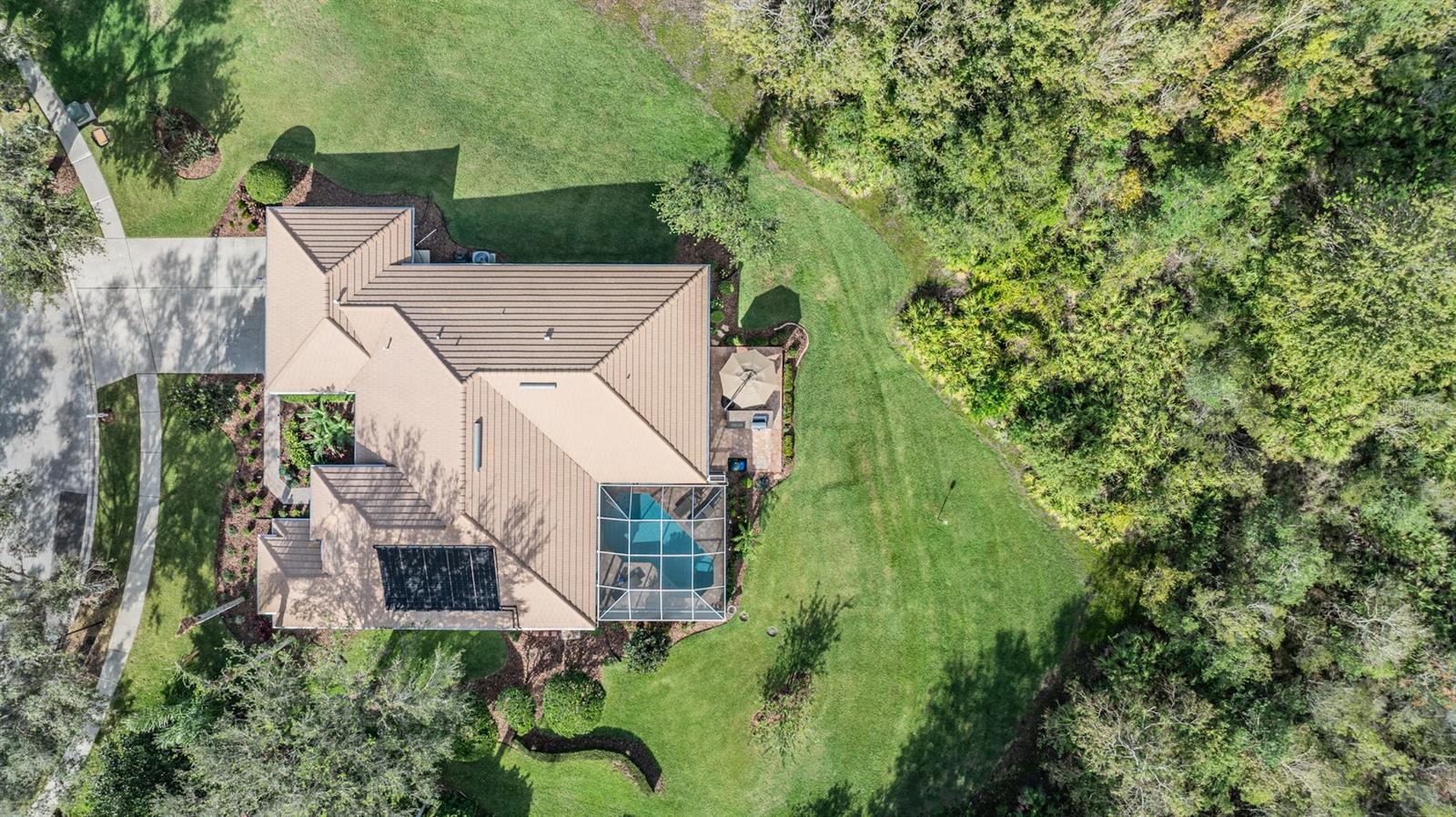 Drone Overview of 9317 Cypress Bend and the huge lot! Solar Panels for the Pool.