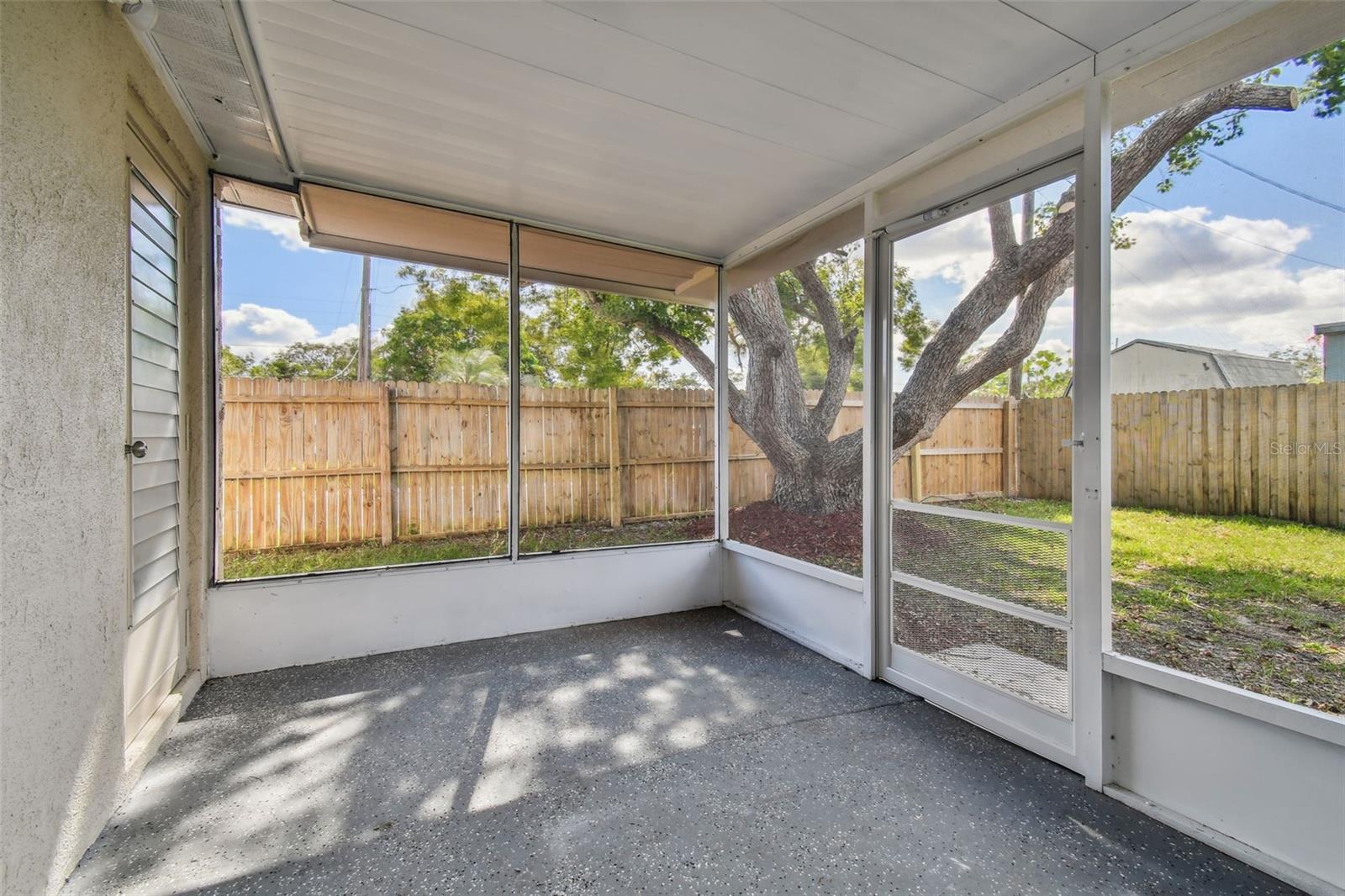 Screen enclosed porch off Florida room & garage