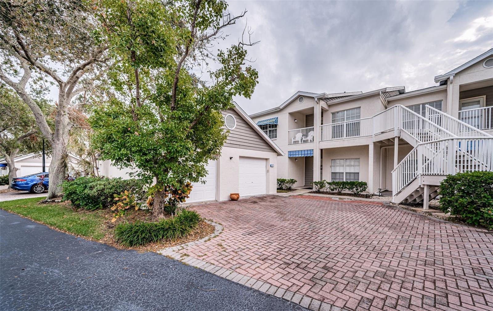 .. Phase Nine - Upper Floor Unit 1915 . 21 x 13 Garage is right next to the Tree.. Condo Conveys with Garage - Parking Pad & Guest Parking.