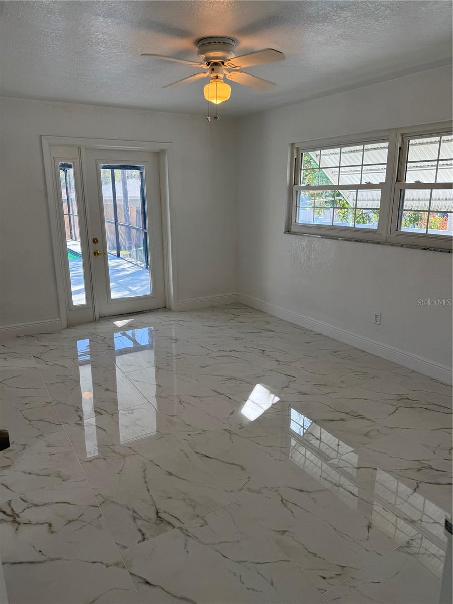 Master bedroom with exit to the pool area