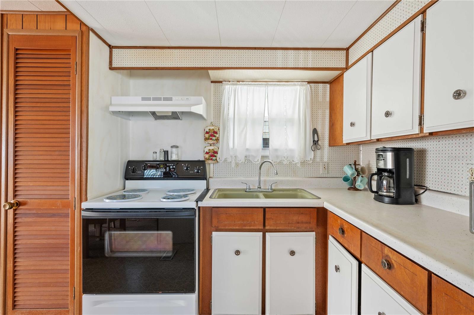 This kitchen has two pantry areas with plenty of storage.