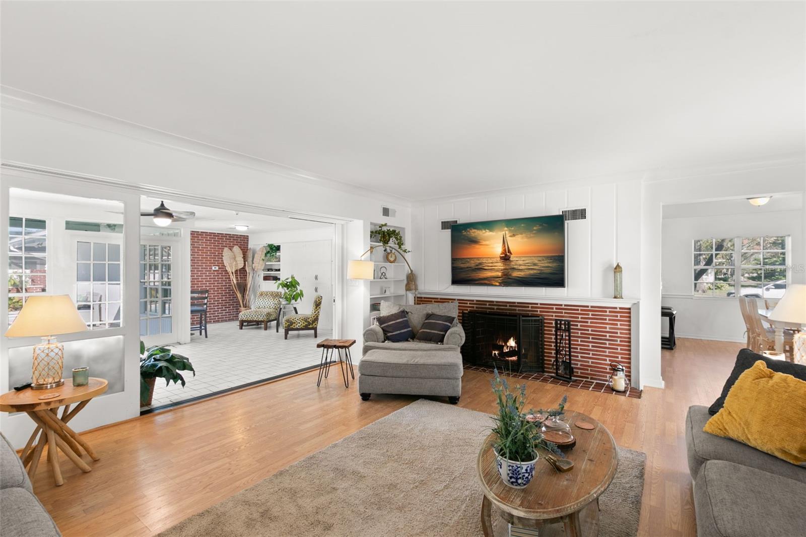 Formal living room with wood burning fireplace