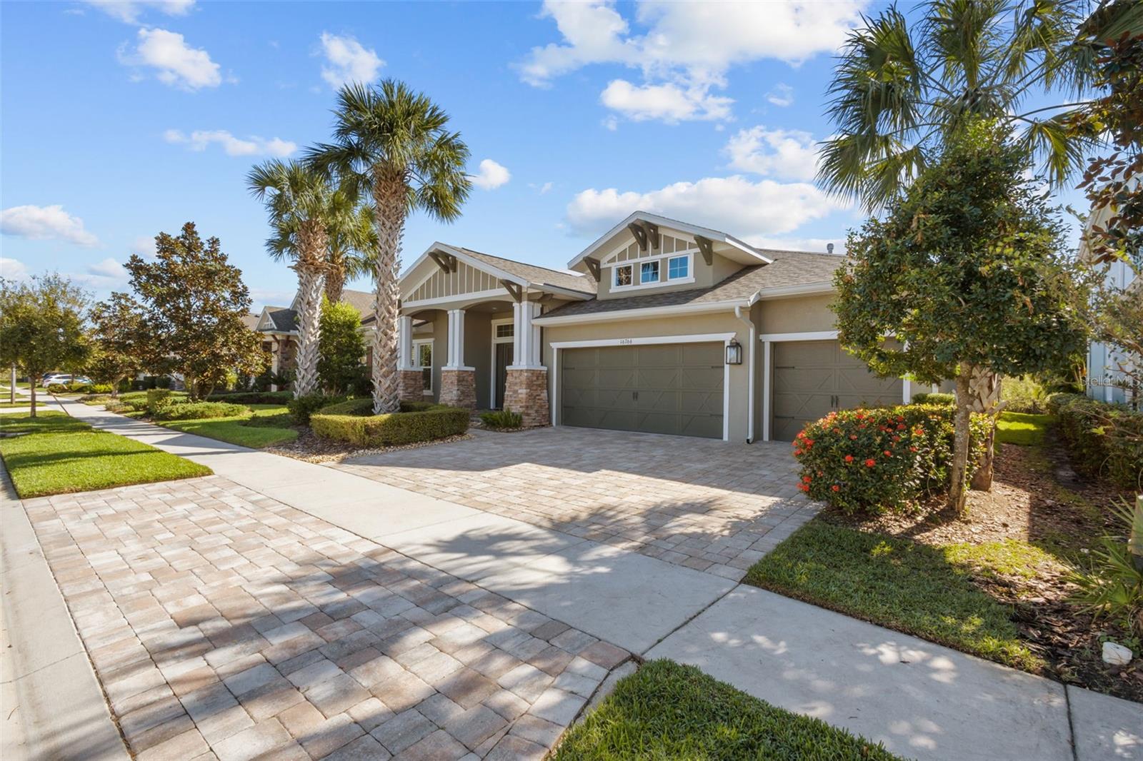 Front of home, pavered driveway