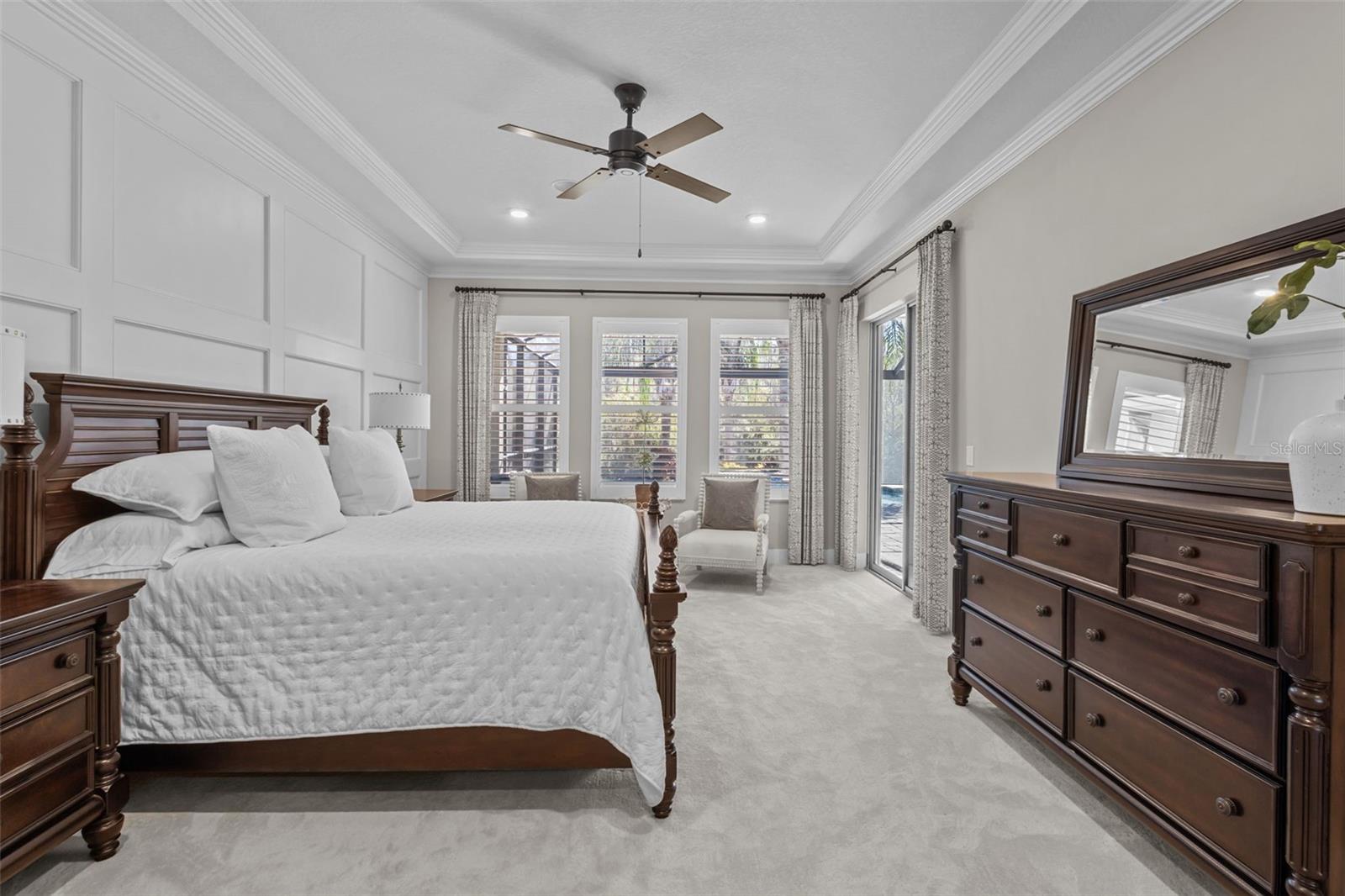 Primary Bedroom - board and batten walls, tray ceiling, walk in custom closets