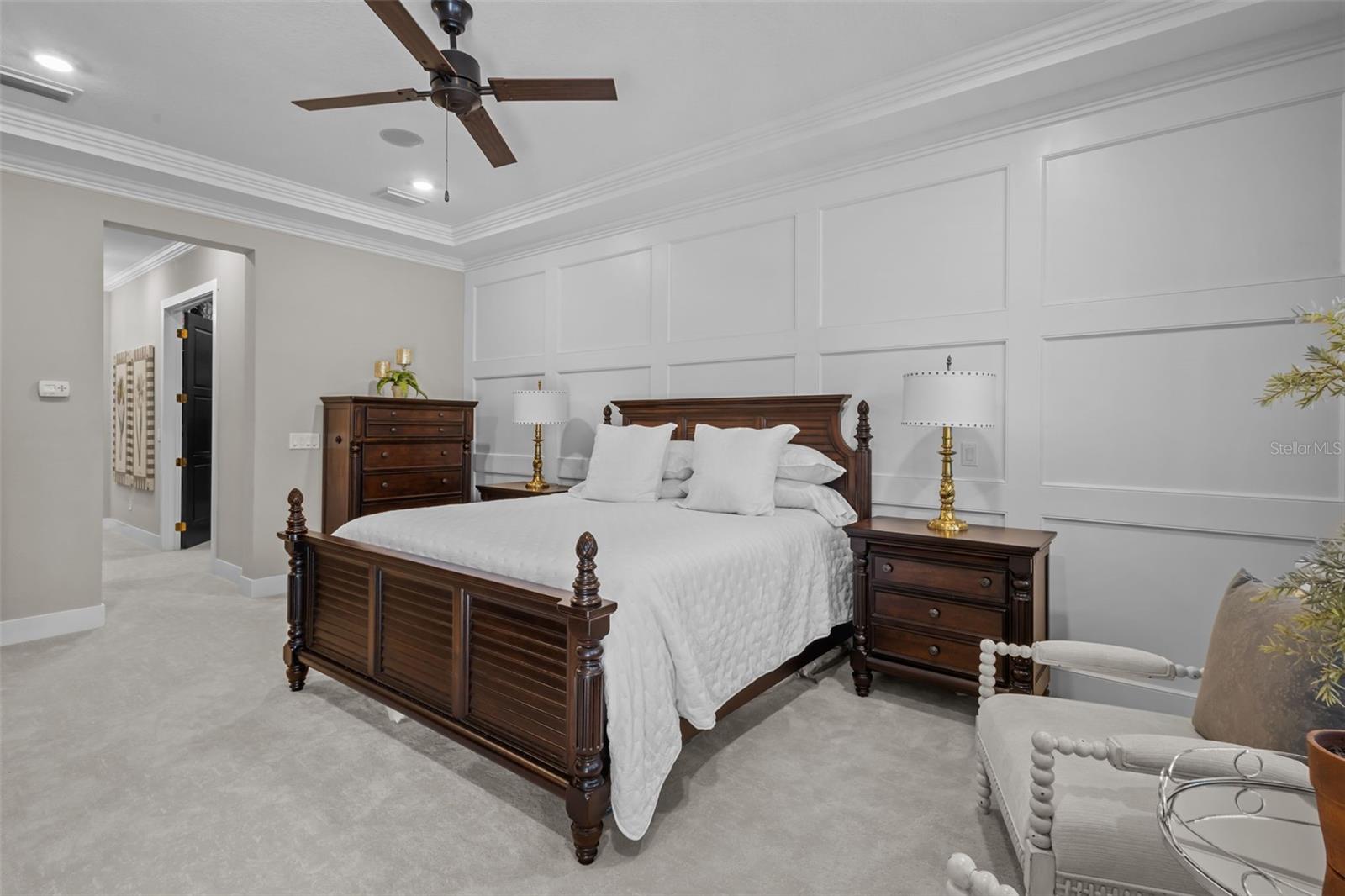 Primary Bedroom - board and batten walls, tray ceiling, walk in custom closets