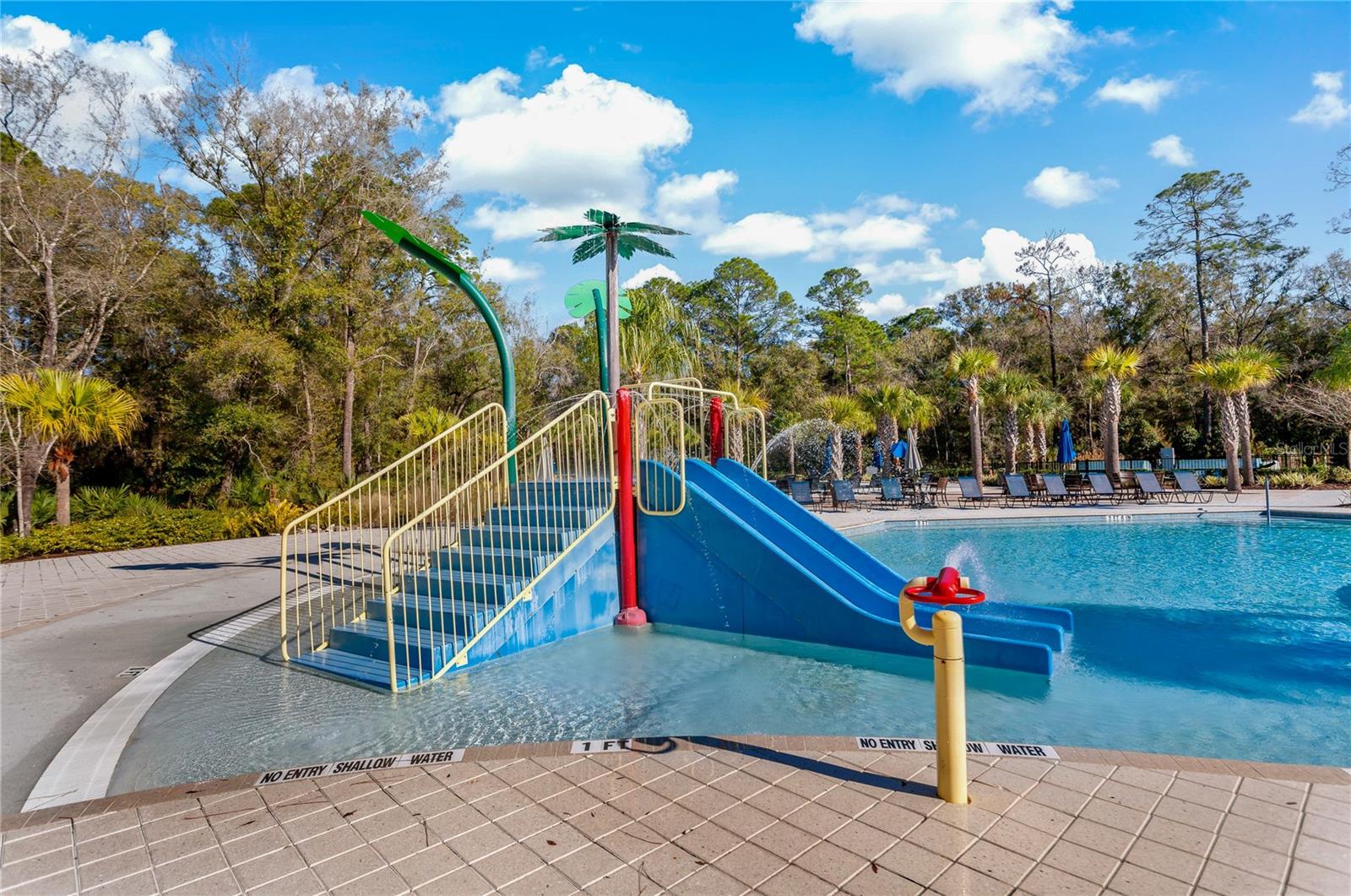 Pool with splash pad play area