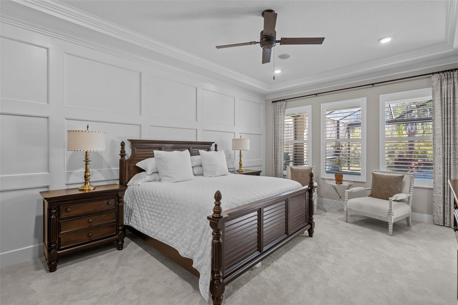 Primary Bedroom - board and batten walls, tray ceiling, walk in custom closets