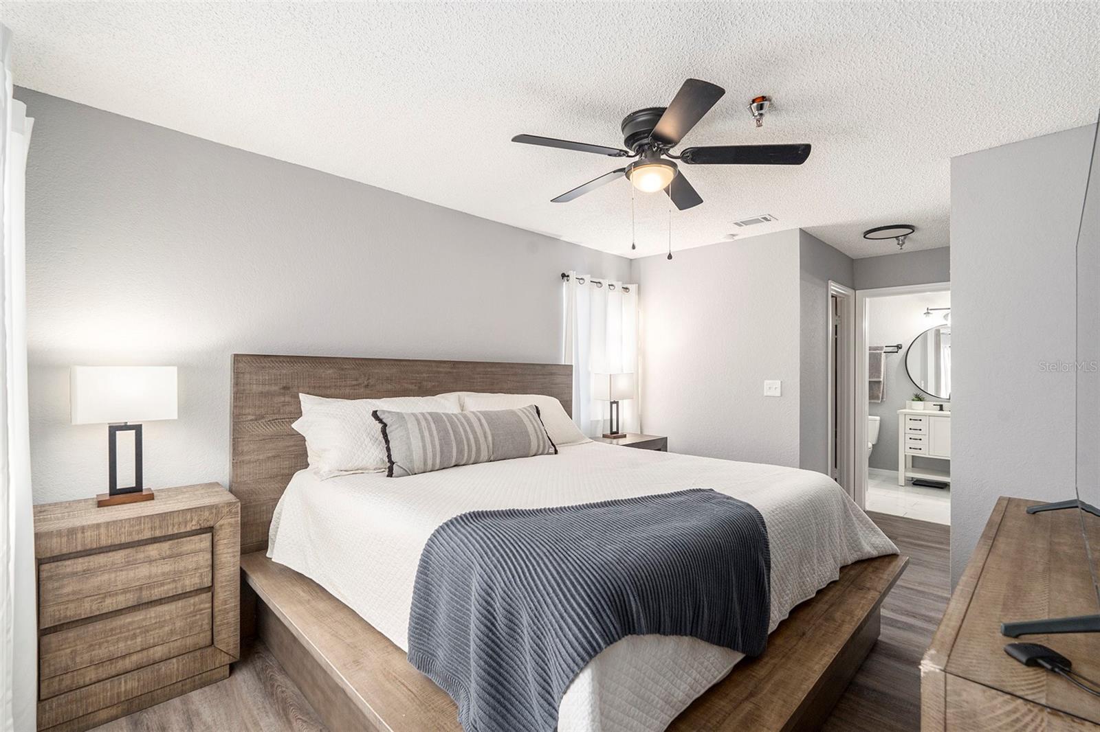 Primary bedroom fits a king bed and two large nightstands.