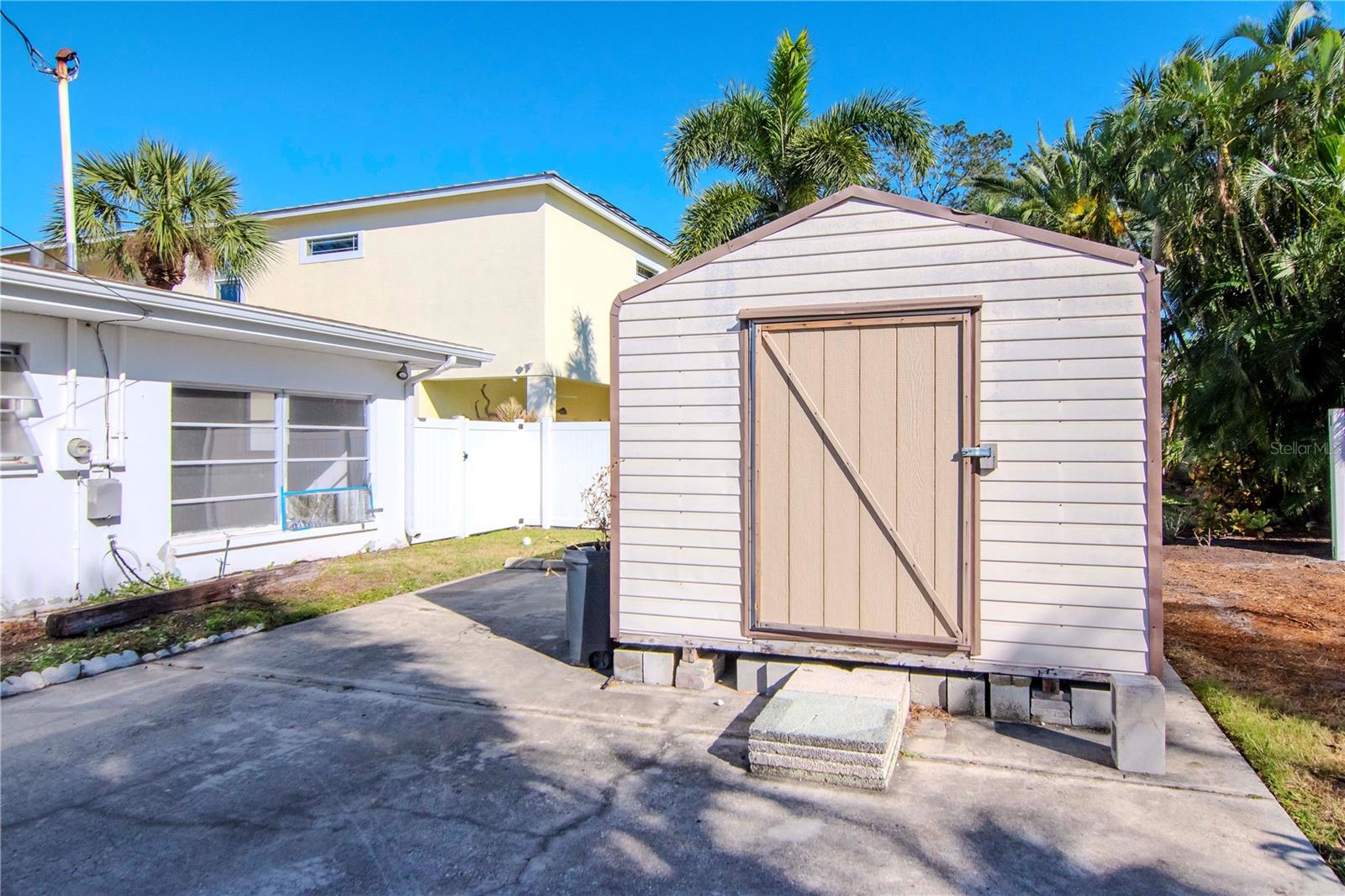 Driveway and shed. Room for a garage.