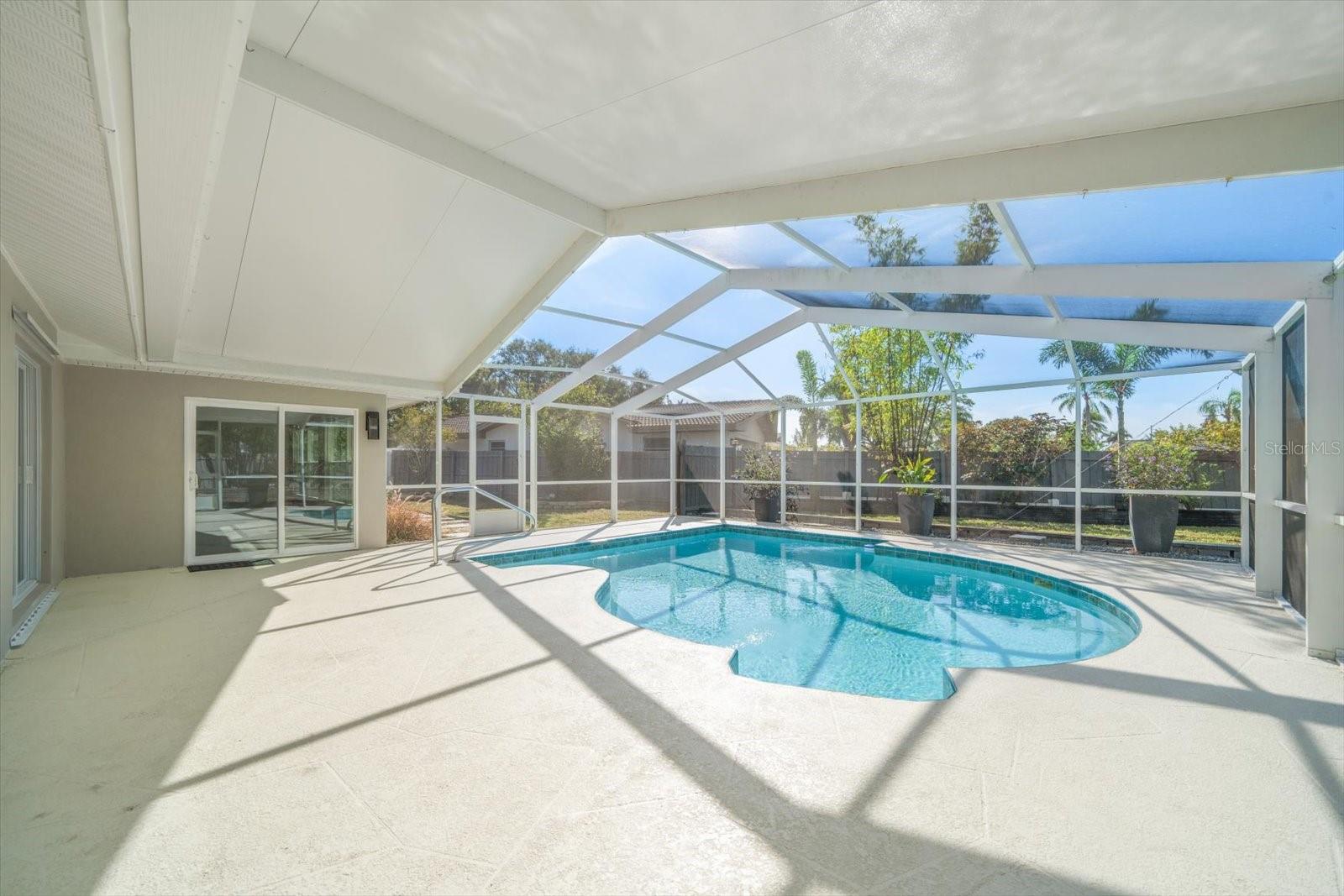 Large patio area around pool.