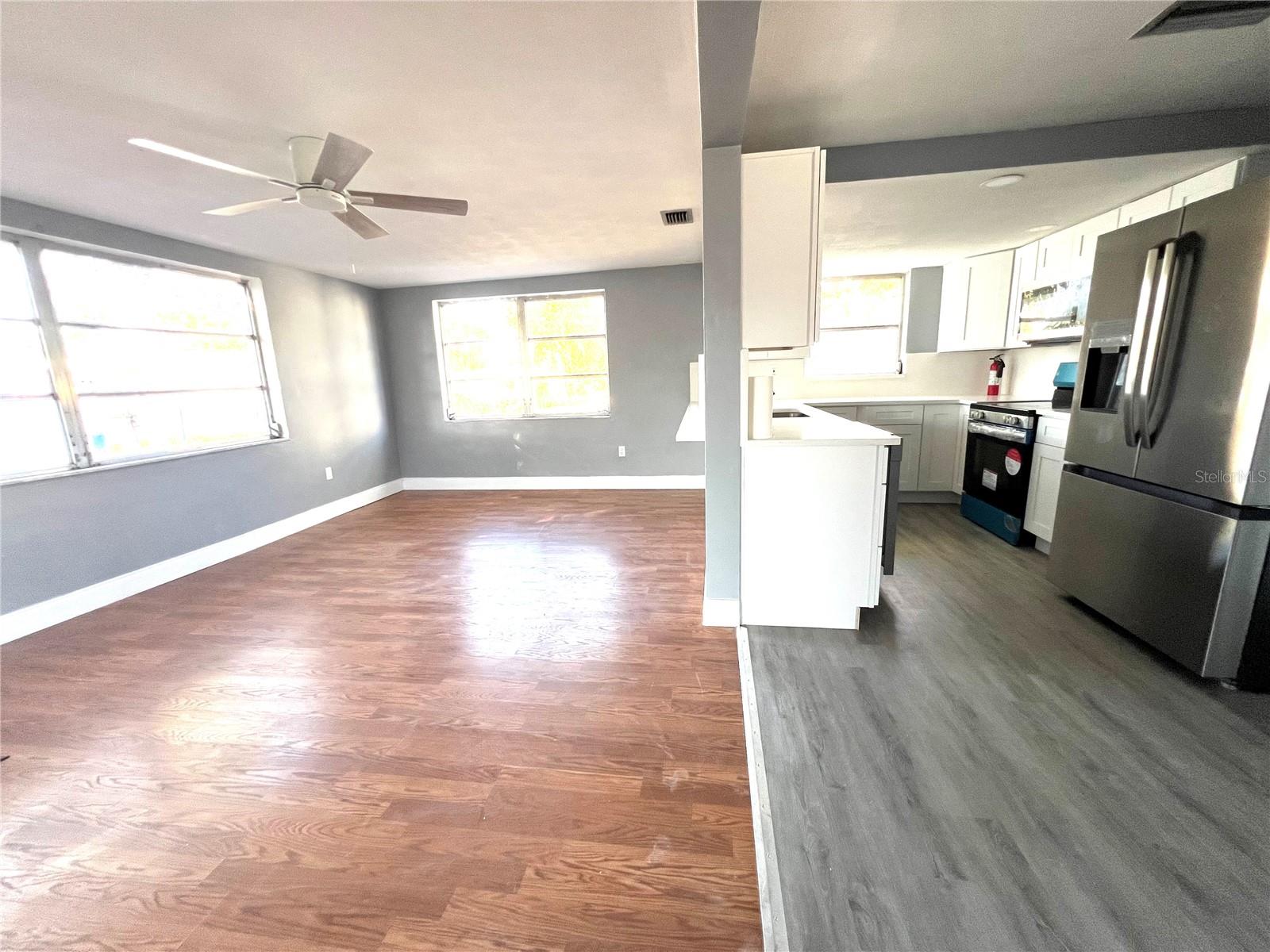 FAMILY ROOM AND KITCHEN VIEW FROM SLIDING DOOR/LANAI