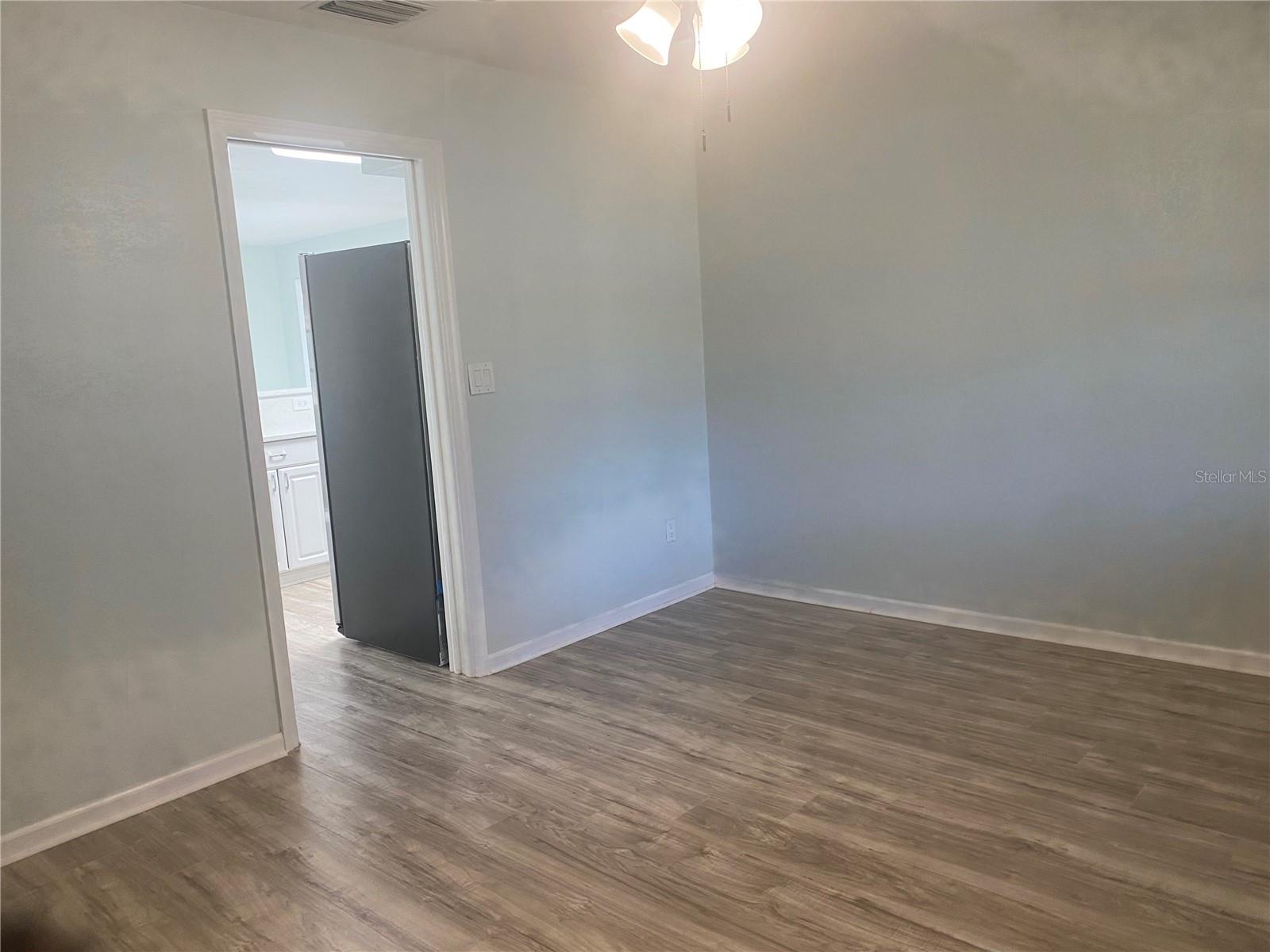 office leading into kitchen