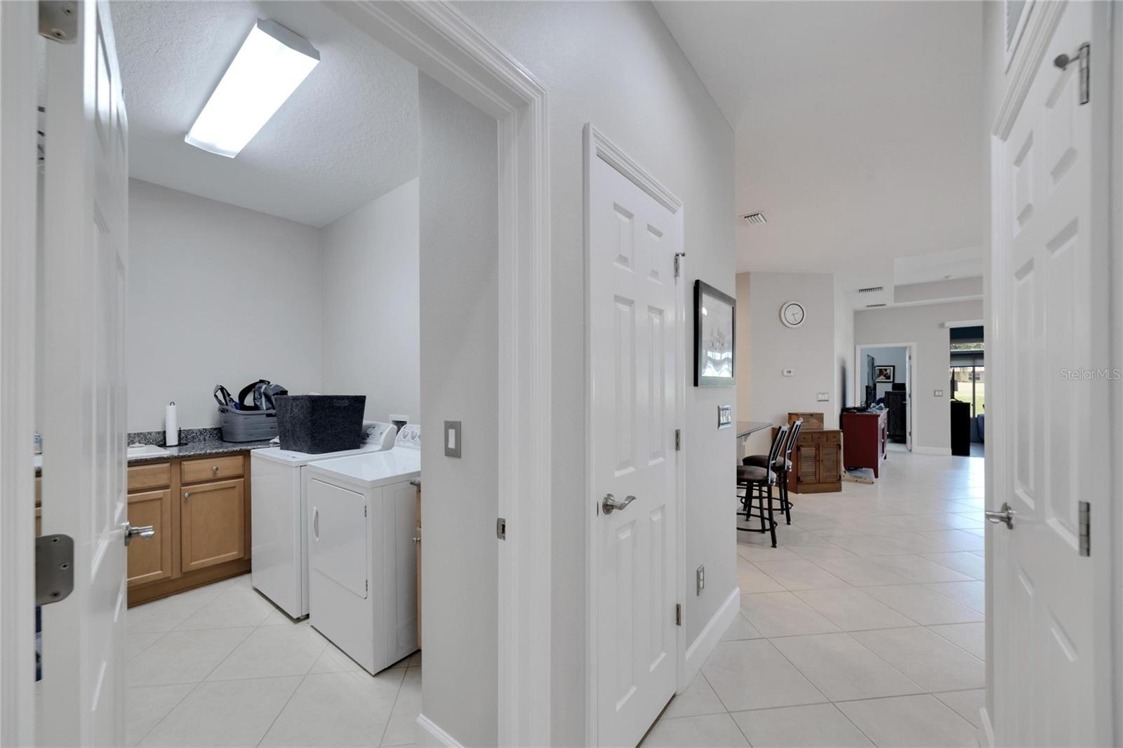 Separate laundry room with storage