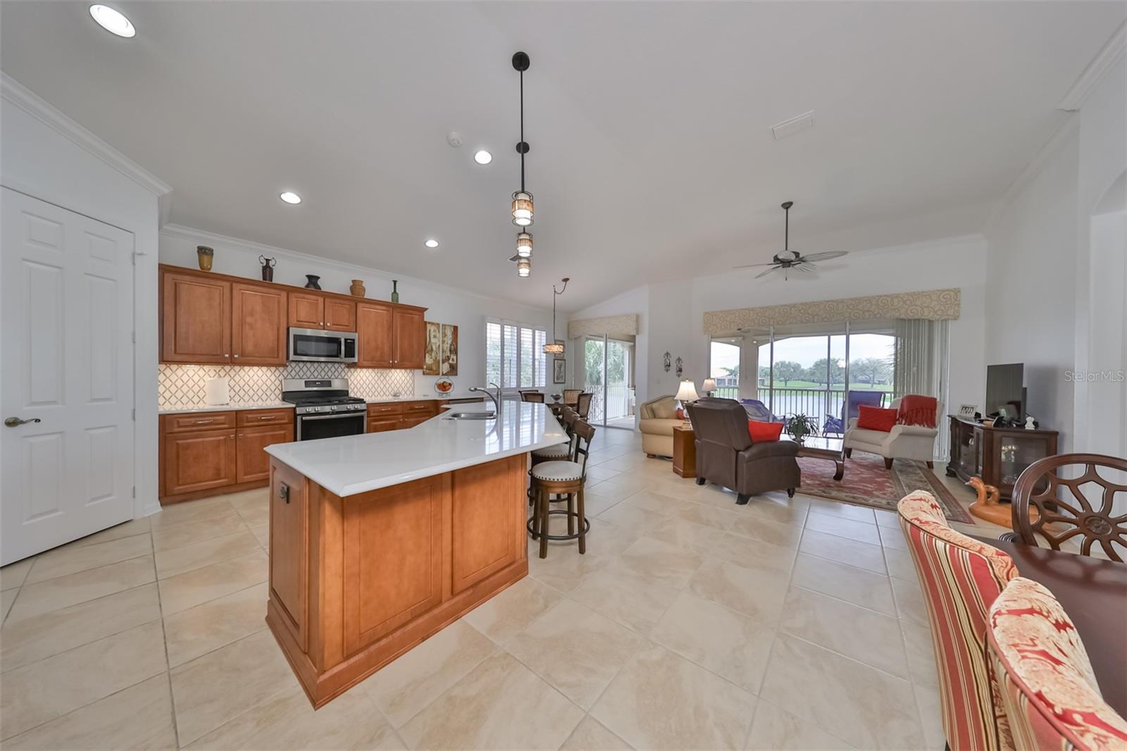 As you walk into the main living area, water/golf course views are seen in every room. This large open floor draws you in and you immediately feel the tranquility.