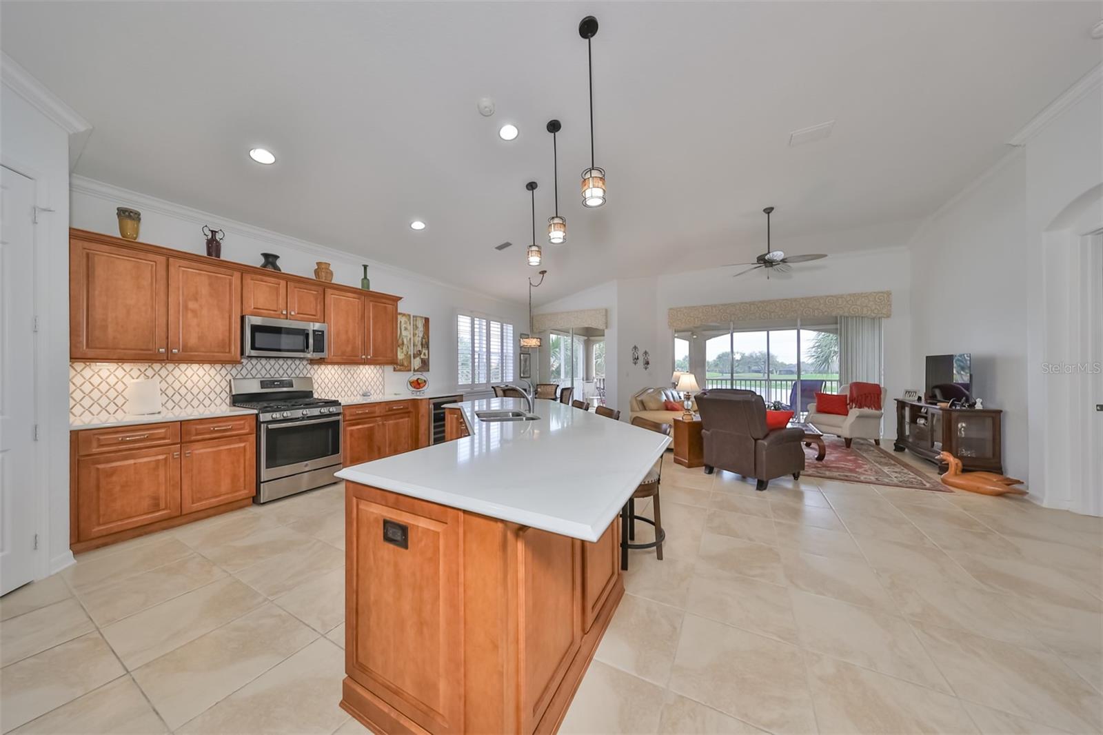 Soft elegance describes this kitchen with quartz countertops that add a little extra "sparkle" to the room for a finished, beautiful, clean touch.