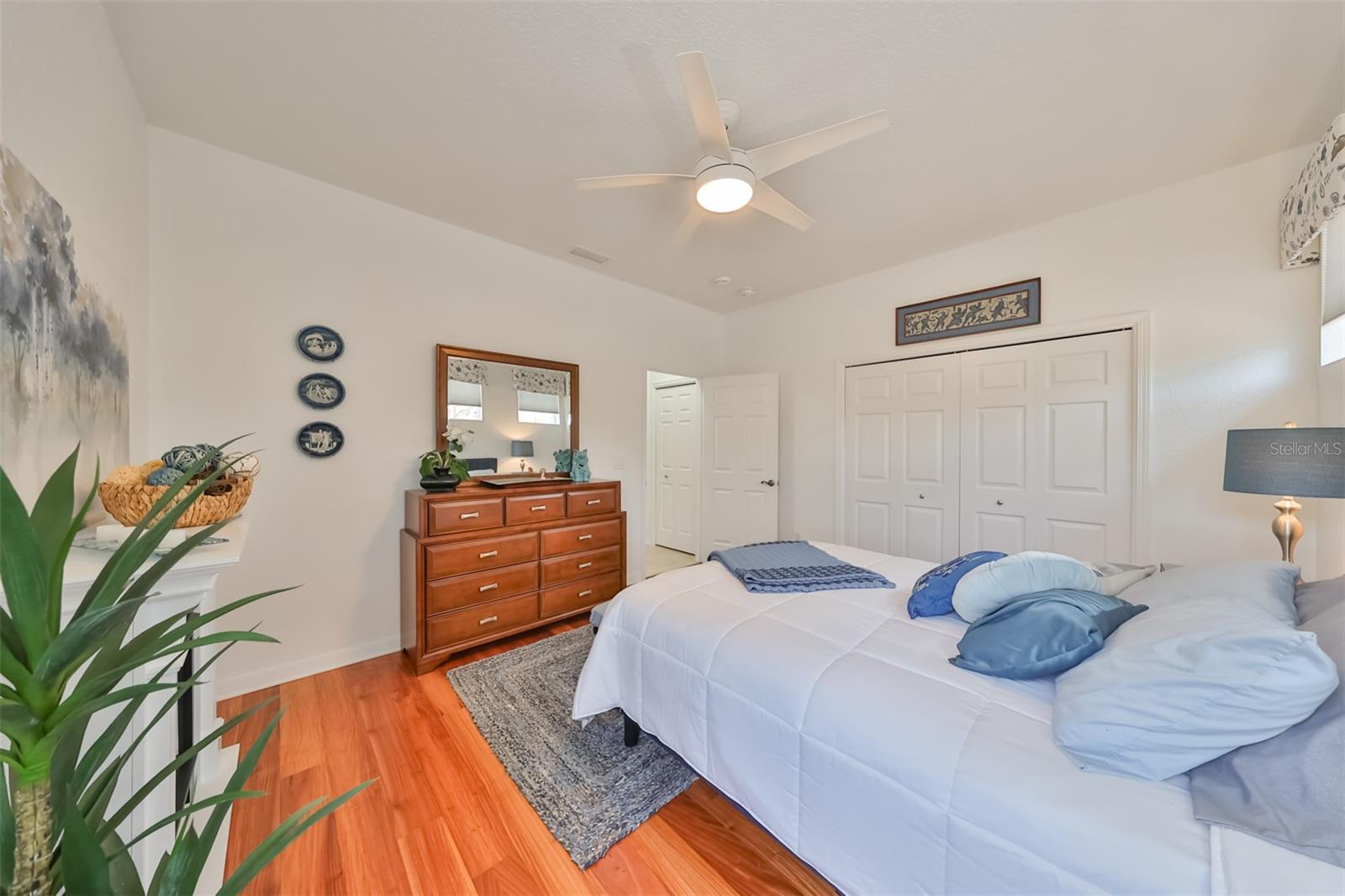 Bedroom #2 has neutral colors, custom ceiling fan and large closets. Your guests may never leave!