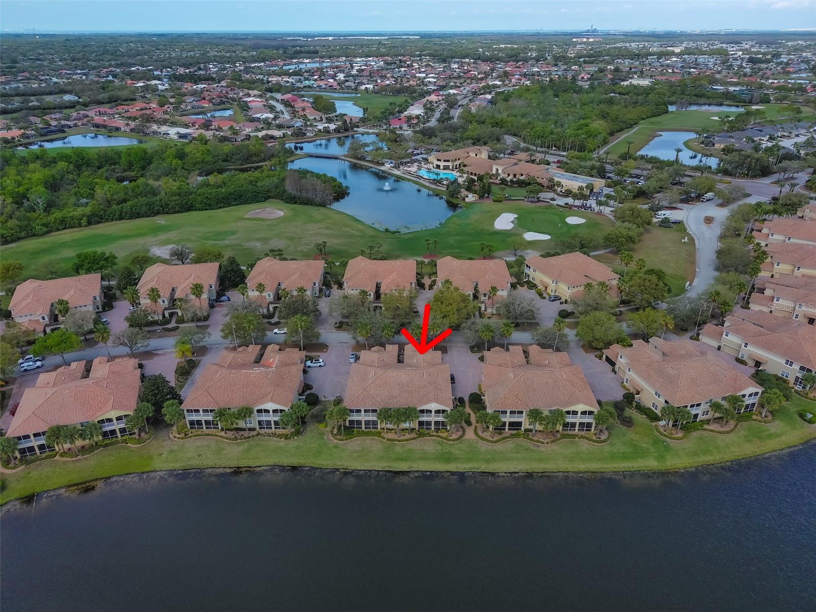 Ariel view of condo and water.