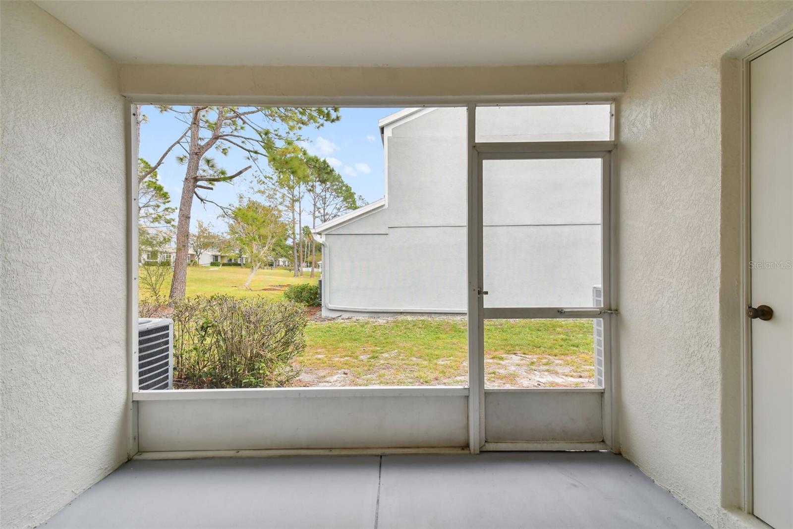 Recently painted patio with additional storage closet.