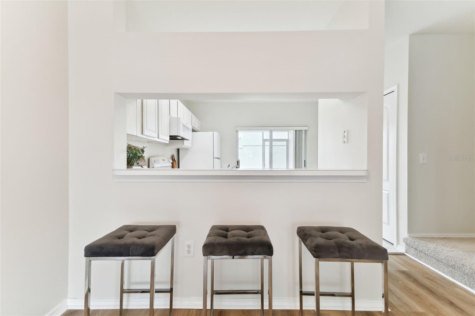 Living/Dining room flows seamlessly over breakfast bar into kitchen