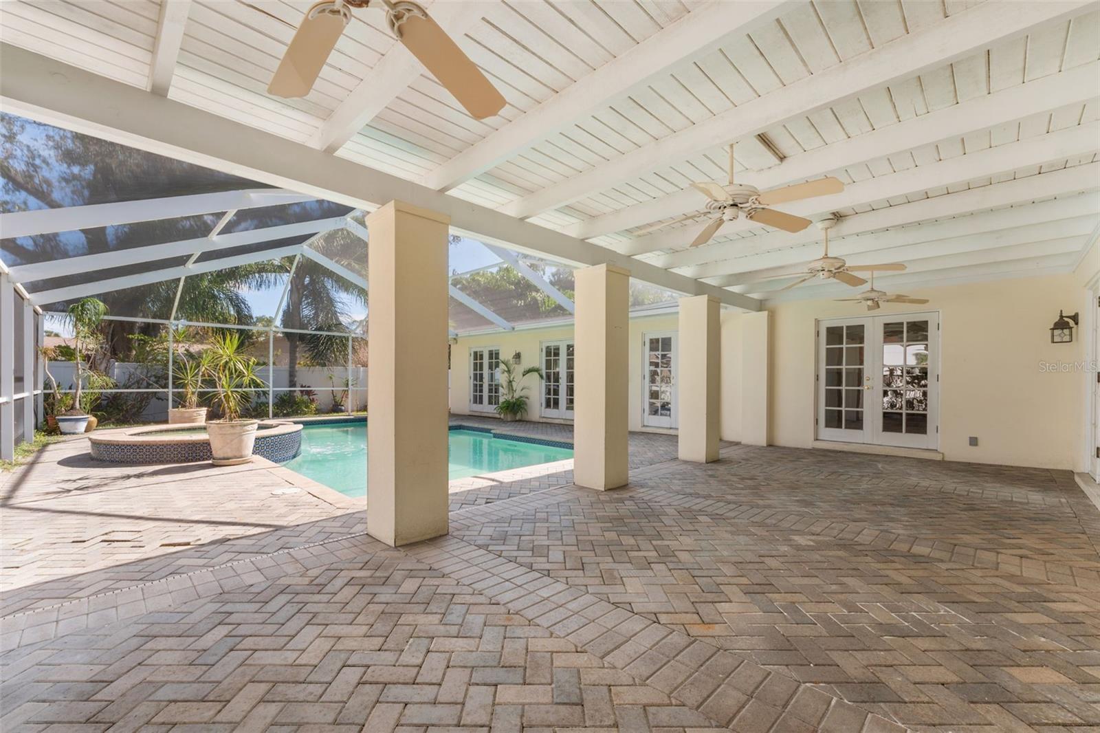 Herringbone paver lanai & paneled ceiling