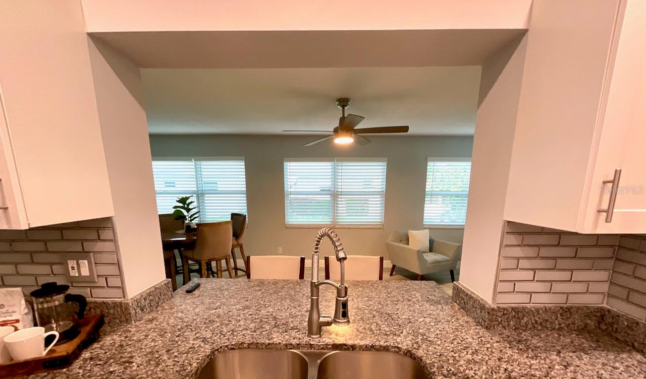 Kitchen sink view to family room