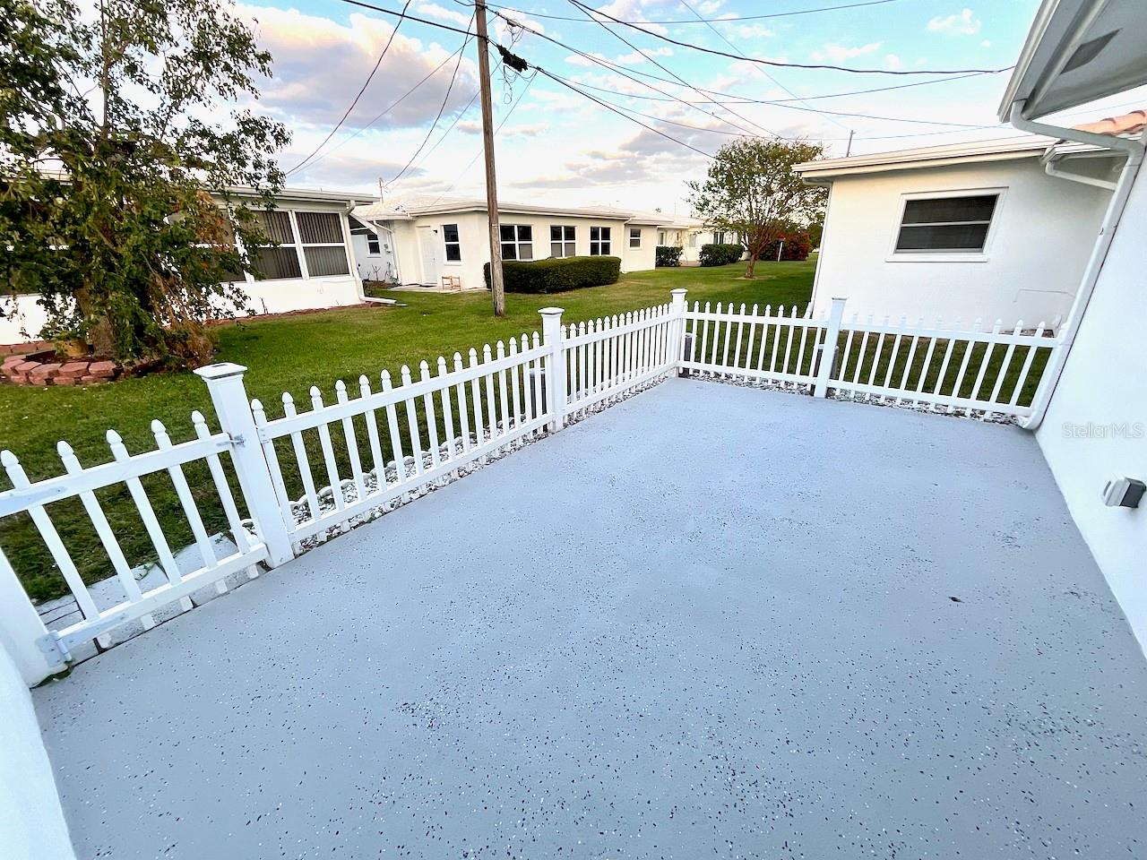 Fenced back patio off family room