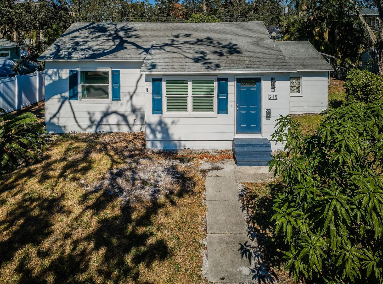 Adorable 2/1 cottage on an oversized lot in Northeast Shores. Landscape virtually enhanced in the photo.