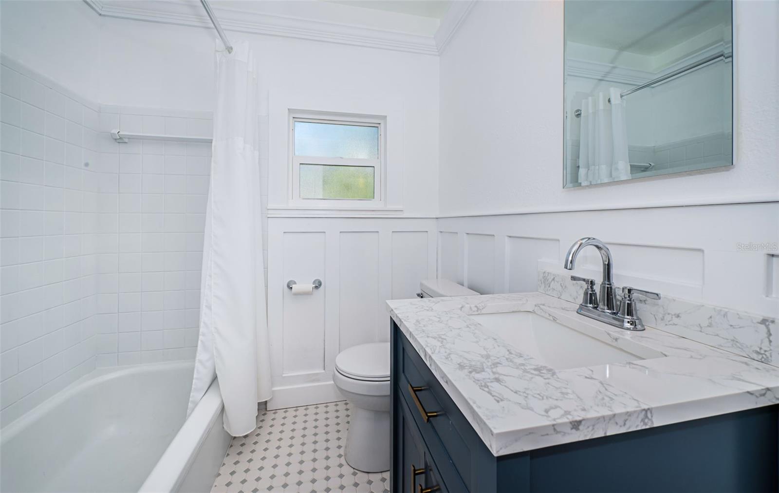 Hall bath with tub/shower.