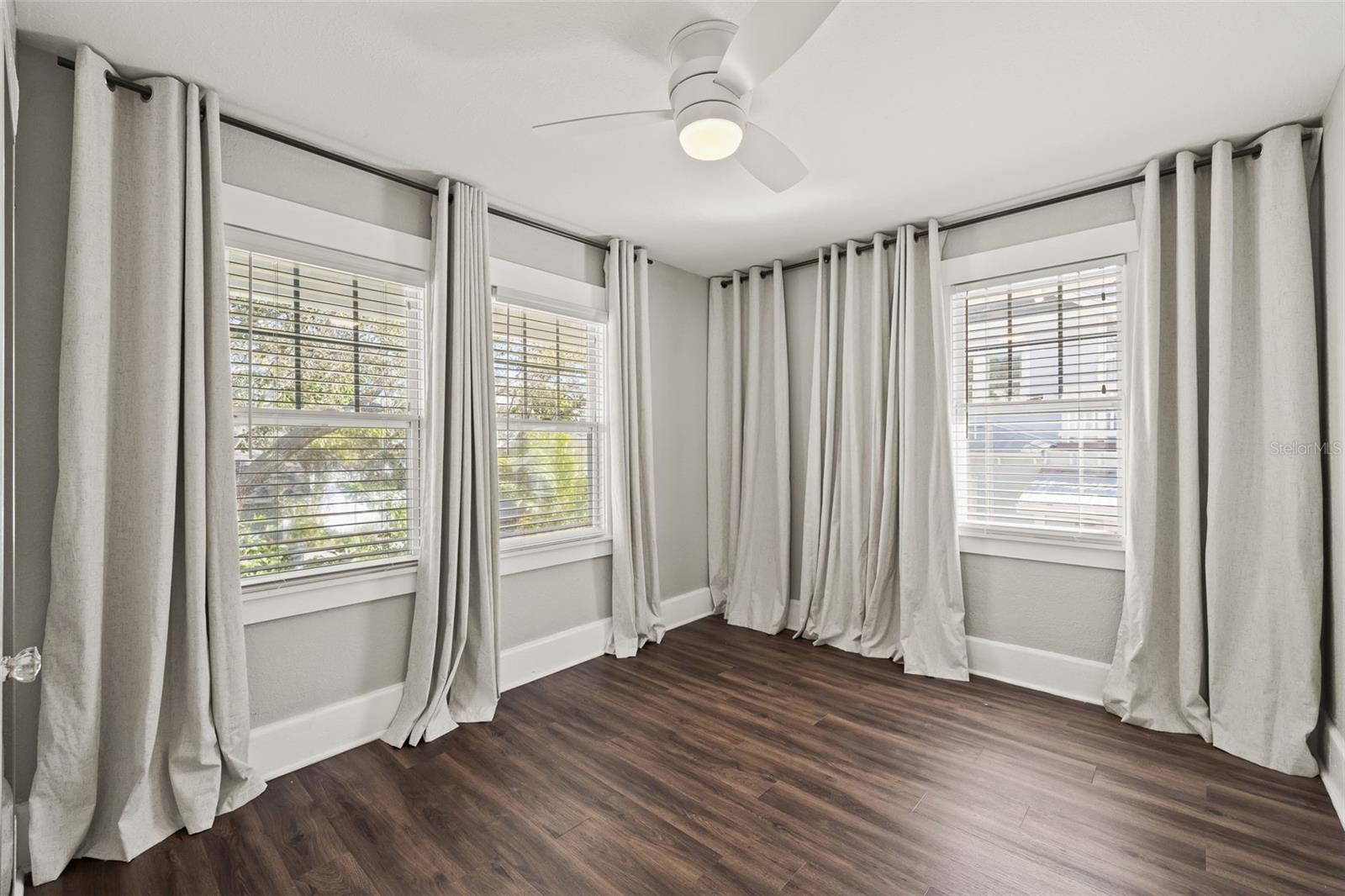 Well lit garage apartment bedroom